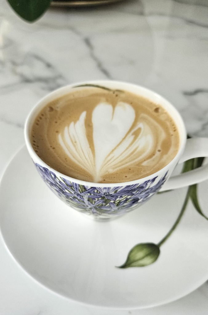 Beautiful latte art in a floral cup