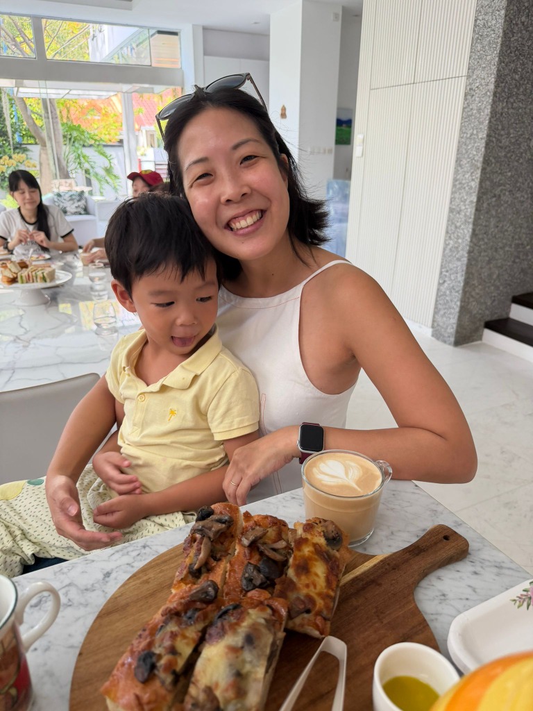 Happy mom and child with coffee and pastries